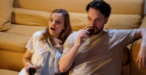 couple watching while drinking wine
